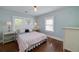 Bedroom with hardwood floors, natural light from large windows, and neutral decor at 2795 Kimmeridge Dr, Atlanta, GA 30344