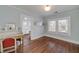 Bedroom with hardwood floors, desk, vanity, and natural light from two windows at 2795 Kimmeridge Dr, Atlanta, GA 30344