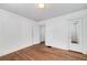 An empty bedroom features a hardwood floor and an overhead light fixture at 2795 Kimmeridge Dr, Atlanta, GA 30344
