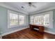 Bright bedroom featuring hardwood floors, white ceiling with ceiling fan, and large windows at 2795 Kimmeridge Dr, Atlanta, GA 30344