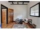Bedroom featuring hardwood floors, white walls, black beams and natural lighting from one window at 3007 Pasadena Dr, Decatur, GA 30032