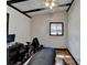 Bedroom featuring hardwood floors, white walls, black beams and natural lighting from one window at 3007 Pasadena Dr, Decatur, GA 30032