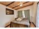 Bedroom featuring a wood plank ceiling, neutral walls, and light-colored wood floors at 3007 Pasadena Dr, Decatur, GA 30032