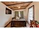 Bedroom featuring a wood plank ceiling, neutral walls, and light-colored wood floors at 3007 Pasadena Dr, Decatur, GA 30032