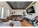 Comfortable living room with a large sectional sofa, hardwood floors, modern ceiling, and a big-screen TV at 3007 Pasadena Dr, Decatur, GA 30032