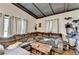 Spacious living room with a comfortable gray sectional, hardwood floors, and plenty of natural light at 3007 Pasadena Dr, Decatur, GA 30032