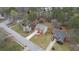 Aerial shot showcases the landscaped yard and brick home with an attached two-car garage at 3061 Stone Bridge Sw Trl, Conyers, GA 30094