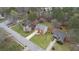 Aerial shot showcases the landscaped yard and brick home with an attached two-car garage at 3061 Stone Bridge Sw Trl, Conyers, GA 30094