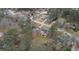 This aerial view shows the home and lot, with mature trees and lush green lawns at 3061 Stone Bridge Sw Trl, Conyers, GA 30094