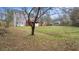 View of the home's spacious backyard with a large deck and a partial fence at 3061 Stone Bridge Sw Trl, Conyers, GA 30094