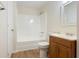 Bathroom with a shower-tub combination and wooden vanity that provides storage at 3061 Stone Bridge Sw Trl, Conyers, GA 30094