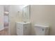 A bathroom featuring a white vanity and toilet with tile flooring at 3061 Stone Bridge Sw Trl, Conyers, GA 30094