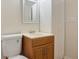 A cozy bathroom features oak vanity, toilet, and ample storage, offering functionality and style at 3061 Stone Bridge Sw Trl, Conyers, GA 30094