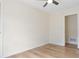 Well-lit bedroom featuring a ceiling fan and light-colored wood-look flooring at 3061 Stone Bridge Sw Trl, Conyers, GA 30094