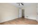Bedroom with wood-look floors, ceiling fan, and neutral paint at 3061 Stone Bridge Sw Trl, Conyers, GA 30094