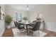 Elegant dining room with modern furnishings, wainscoting, and natural light at 3061 Stone Bridge Sw Trl, Conyers, GA 30094