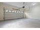 A spacious garage featuring an automatic door, a large open area for parking and storage at 3061 Stone Bridge Sw Trl, Conyers, GA 30094