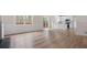 An open floor plan showcases hardwood floors and a bright kitchen with stainless steel appliances at 3061 Stone Bridge Sw Trl, Conyers, GA 30094