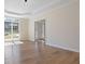 Living room with a large window and tray ceiling at 3061 Stone Bridge Sw Trl, Conyers, GA 30094