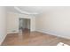 Spacious living room with wood-look flooring and tray ceiling at 3061 Stone Bridge Sw Trl, Conyers, GA 30094