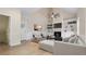 Cozy living room featuring a fireplace, built-in bookshelves, and hardwood floors at 3061 Stone Bridge Sw Trl, Conyers, GA 30094