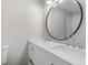 Bathroom featuring double sinks, a large mirror, and modern lighting fixtures at 6382 Revena Dr, Morrow, GA 30260