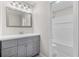 Beautiful bathroom features a grey vanity, modern fixtures, and tile flooring at 6382 Revena Dr, Morrow, GA 30260