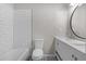 Bathroom featuring a shower/tub combination, modern toilet, and vanity with plenty of storage at 6382 Revena Dr, Morrow, GA 30260