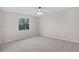 Bright bedroom with a large window that provides great natural light and plush carpet at 6382 Revena Dr, Morrow, GA 30260
