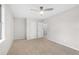Spacious bedroom with neutral tones, plush carpeting, and modern ceiling fan at 6382 Revena Dr, Morrow, GA 30260
