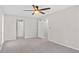 Spacious bedroom with neutral tones, plush carpeting, and modern ceiling fan at 6382 Revena Dr, Morrow, GA 30260