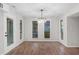 Bright dining room with modern lighting and lots of windows at 6382 Revena Dr, Morrow, GA 30260