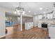 Modern kitchen with white cabinets, granite countertops, and stainless steel appliances at 6382 Revena Dr, Morrow, GA 30260