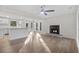 Bright living room with hardwood floors, fireplace, and open floor plan at 6382 Revena Dr, Morrow, GA 30260
