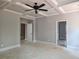 Bedroom with trey ceiling, ceiling fan, and doorways to additional rooms at 6841 Phillips Mill Rd, Douglasville, GA 30135