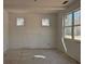 Awaiting transformation, this bedroom boasts dual windows, natural light, and serene outdoor views at 6841 Phillips Mill Rd, Douglasville, GA 30135