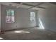 A bedroom with coffered ceiling and bright windows creates a welcoming space at 6841 Phillips Mill Rd, Douglasville, GA 30135