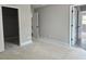 Bedroom shows doors leading to the walk-in closet and another bedroom with neutral walls at 6841 Phillips Mill Rd, Douglasville, GA 30135