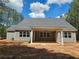 Exterior of home shows backyard porch and ample windows letting in light at 6841 Phillips Mill Rd, Douglasville, GA 30135