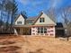 New home exterior with visible construction details and modern window designs at 6841 Phillips Mill Rd, Douglasville, GA 30135