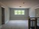 Upstairs hallway featuring a large window with a scenic view and access to several rooms at 6841 Phillips Mill Rd, Douglasville, GA 30135