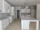 A spacious kitchen featuring granite counters, white cabinets, and stainless steel appliances at 6841 Phillips Mill Rd, Douglasville, GA 30135