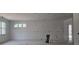 Unfinished living space showcasing open design and great window views at 6841 Phillips Mill Rd, Douglasville, GA 30135