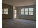 Bright living room featuring large windows and an open door to the outside at 6841 Phillips Mill Rd, Douglasville, GA 30135