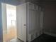 Mudroom area provides storage and bench with convenient access to the entry and garage at 6841 Phillips Mill Rd, Douglasville, GA 30135