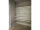 A walk-in pantry with built-in shelving provides plenty of storage space at 6841 Phillips Mill Rd, Douglasville, GA 30135