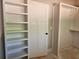Spacious walk-in closet with built-in shelving units provides ample storage space at 6841 Phillips Mill Rd, Douglasville, GA 30135