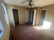 Comfortable bedroom with carpet and doors to closets and bathroom at 7042 Oakhill Cir, Austell, GA 30168