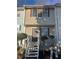 Charming townhouse with a welcoming entrance, featuring well-maintained siding and front steps at 7042 Oakhill Cir, Austell, GA 30168
