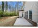 A cozy back patio provides outdoor living space and access to the home's back entrance and lush backyard at 830 Nottingham Se Dr, Smyrna, GA 30082